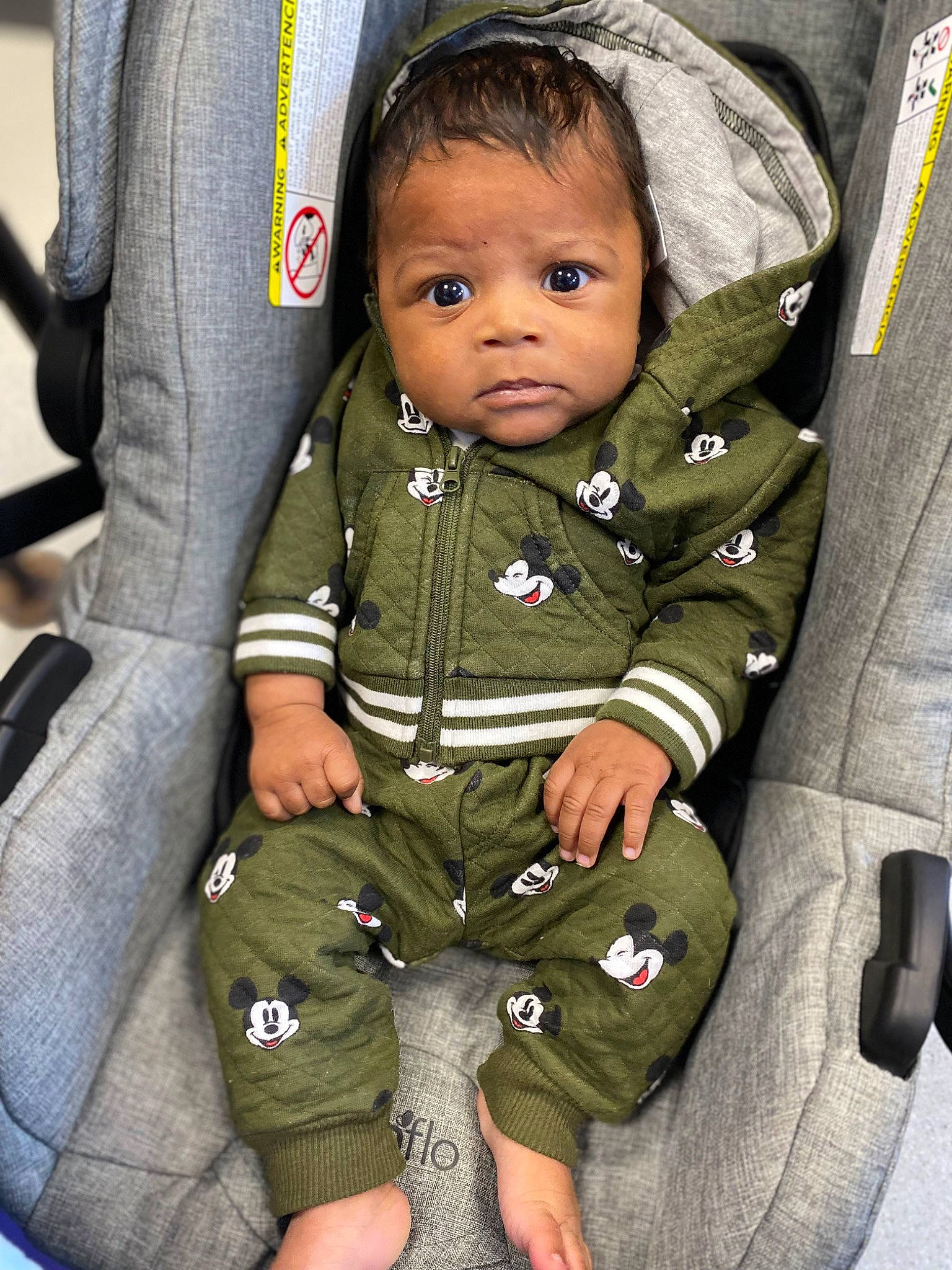 Zayvion joined the competition — help win amazing prizes! baby, baby_toddler_clothing, camouflage, car_seat, cheek, child, collar, comfort, eye, face, gesture, head, military_camouflage, military_person, military_uniform, person, sitting, skin, sleeve, thumb