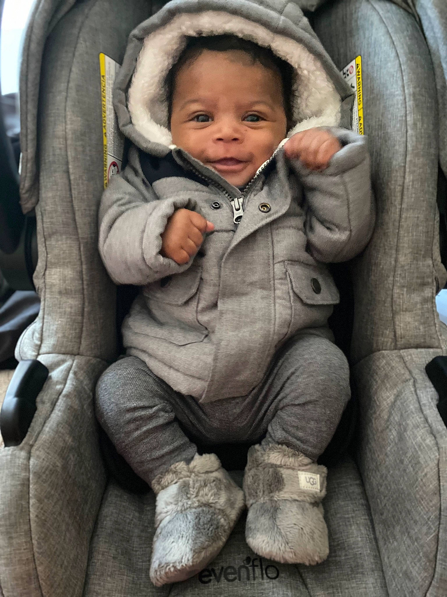 Zayvion is registered to the contest to win money with this photo: auto_part, baby, baby_carriage, baby_products, baby_safety, baby_toddler_clothing, car_seat, cheek, child, comfort, eye, face, finger, grey, head, outerwear, person, sitting, skin, smile