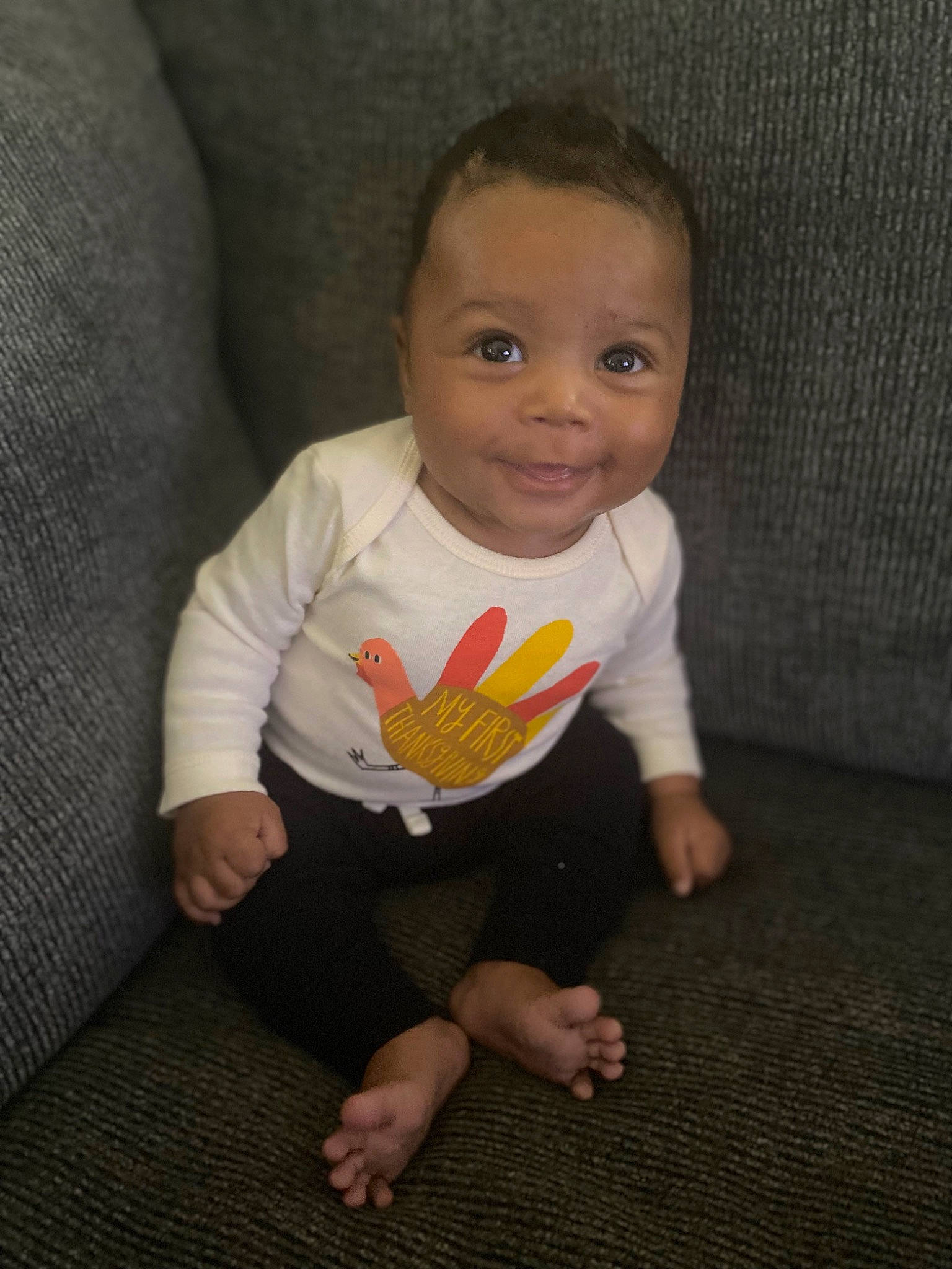 Zayvion is registered to the contest to win money with this photo: baby, baby_toddler_clothing, cheek, chin, clothing, eye, floor, flooring, grey, hair, happy, human_body, iris, joy, nose, person, skin, sleeve, smile, t_shirt