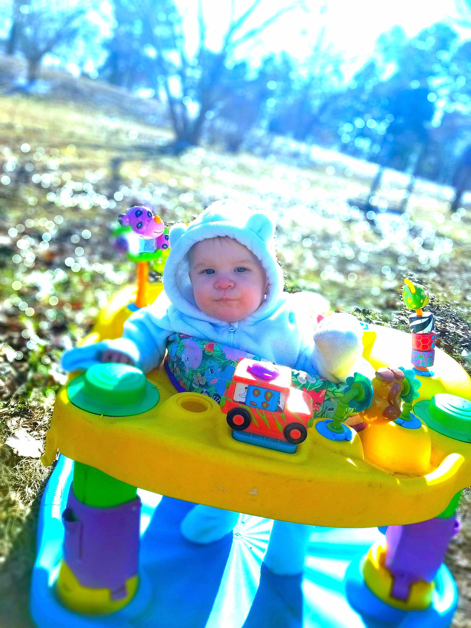 Grey is registered to the contest to win money with this photo: baby, baby_playing_with_toys, baby_products, baby_toddler_clothing, baby_toys, child, headwear, lap, people_in_nature, person, play, playing_with_kids, riding_toy, sitting, toddler