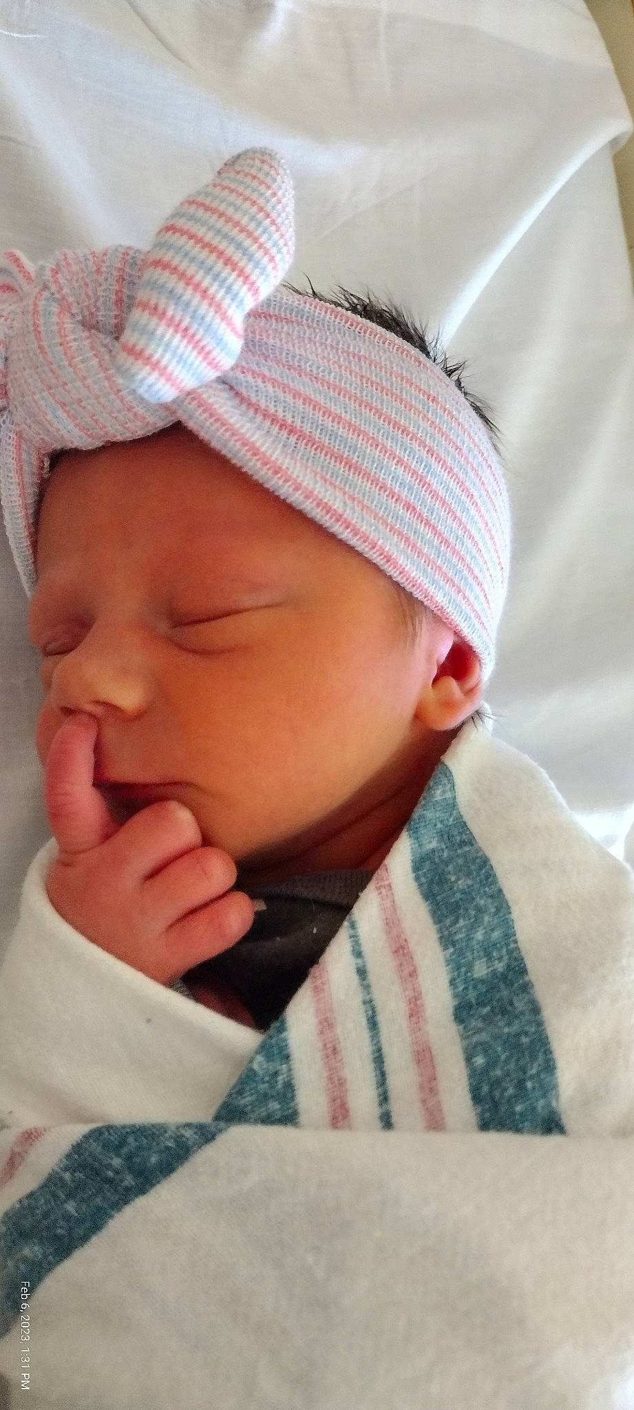 Amanda is registered to the contest to win money with this photo: baby, baby_toddler_clothing, cap, cheek, chin, comfort, ear, eye, eyebrow, eyelash, face, forehead, gesture, head, headgear, lip, mouth, nose, person, skin