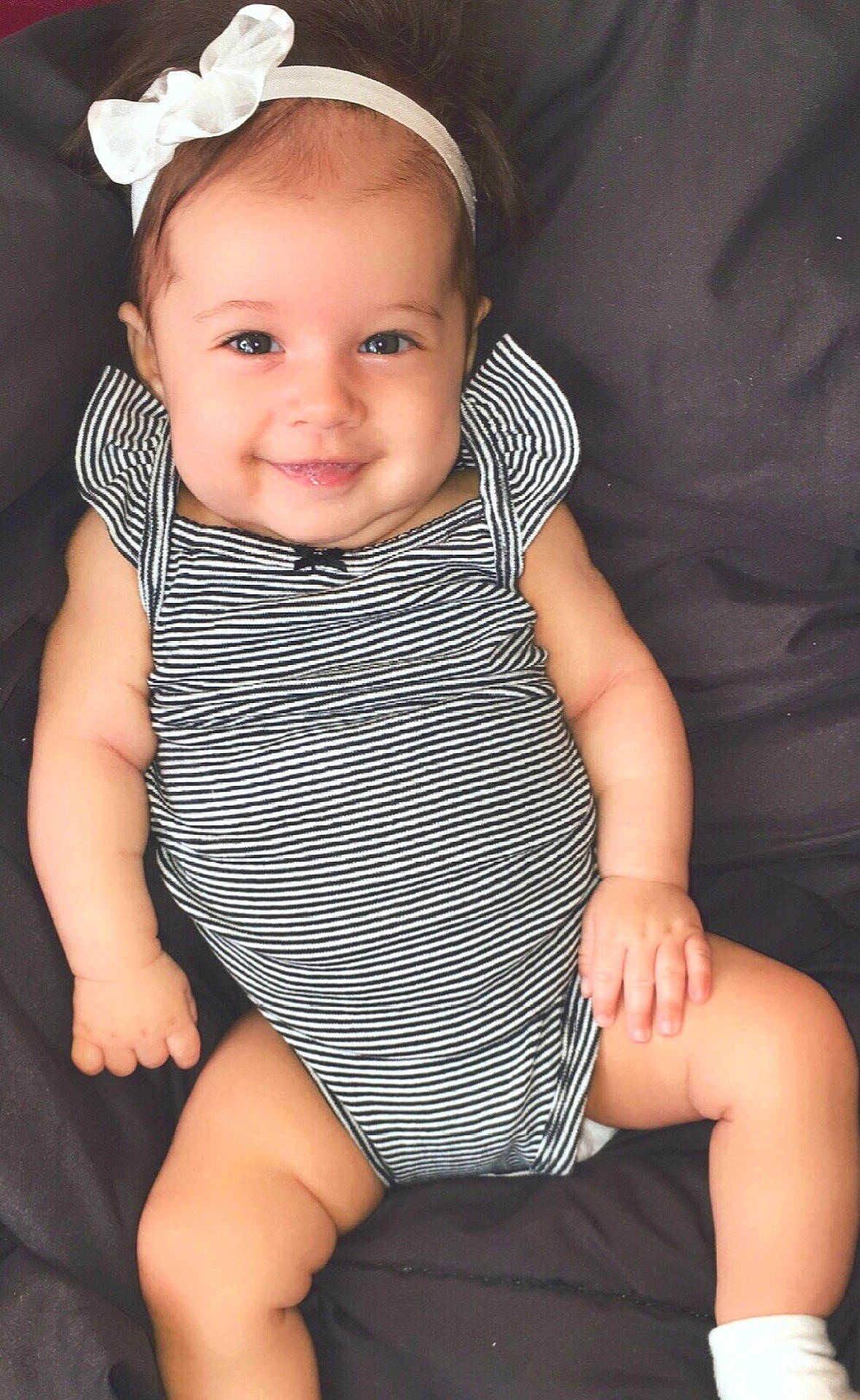 Gionna is registered to the contest to win money with this photo: abdomen, baby_products, child, child_model, girl, hair_accessory, headgear, infant, iris, joy, leg, person, product, sitting, skin, smile, toddler