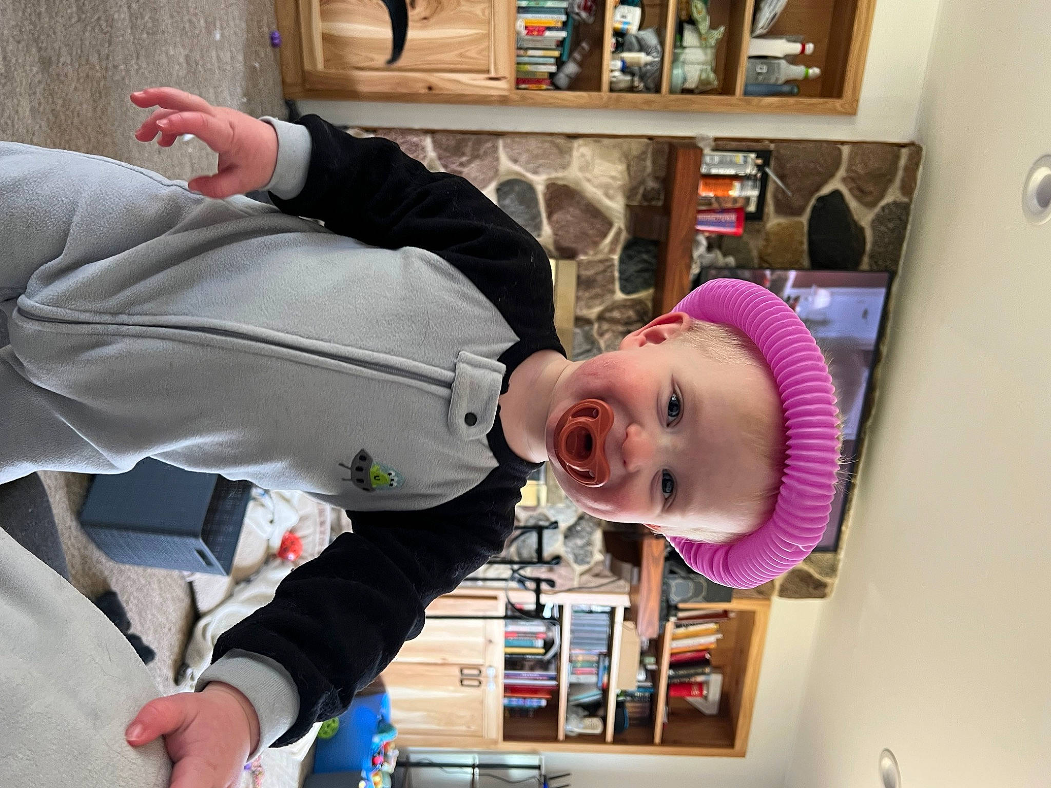 Wyatt joined the competition — help win amazing prizes! baby, bookcase, child, fun, hat, headgear, magenta, outerwear, person, picture_frame, product, room, shelf, shelving, smile, toddler