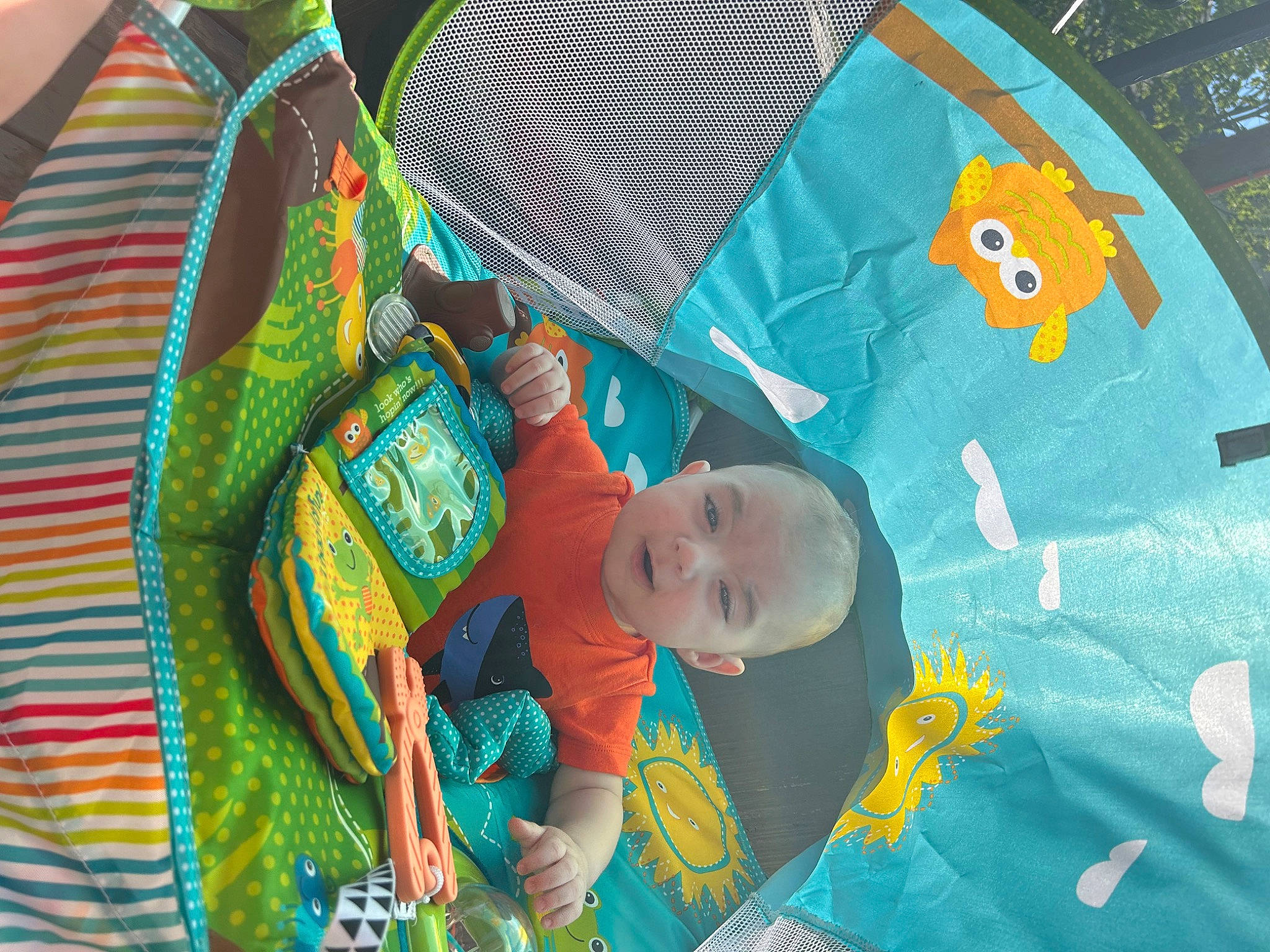 Malachi is registered to the contest to win money with this photo: art, baby, baby_products, baby_toddler_clothing, child, design, fun, happy, linens, nap_mat, pattern, person, plastic, playmat, product, quilt, room, textile, toddler, visual_arts