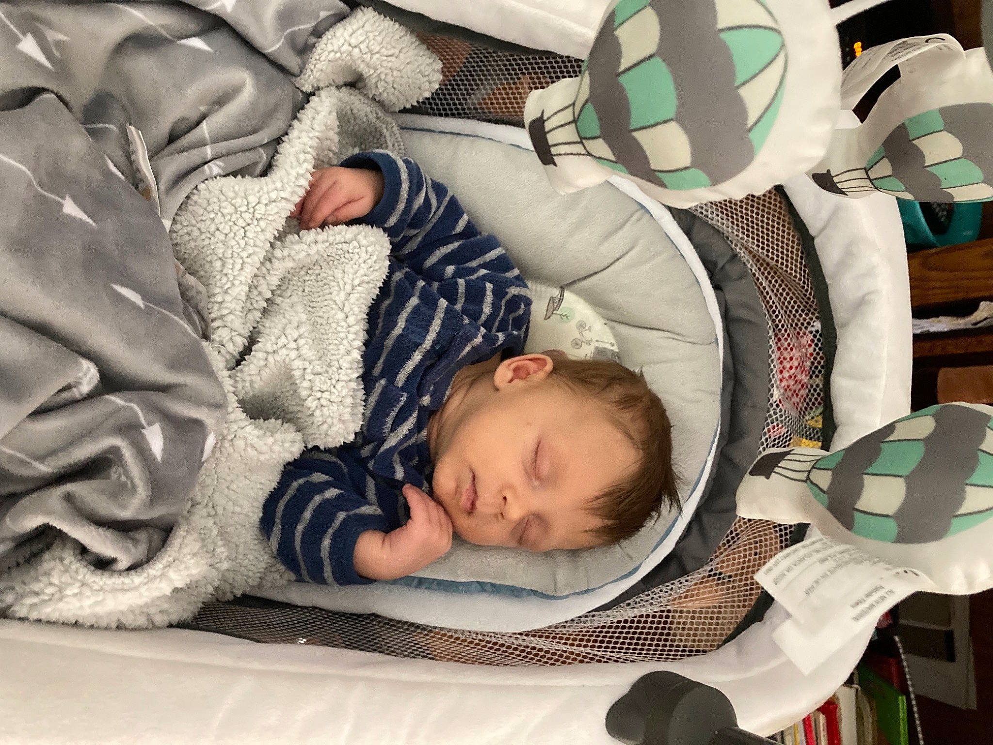 Conrad joined the competition — help win amazing prizes! baby, baby_products, baby_safety, baby_sleeping, baby_toddler_clothing, bed_sheet, bedding, bedtime, child, comfort, football, green, head, infant_bed, linens, nap, pattern, person, textile, toddler