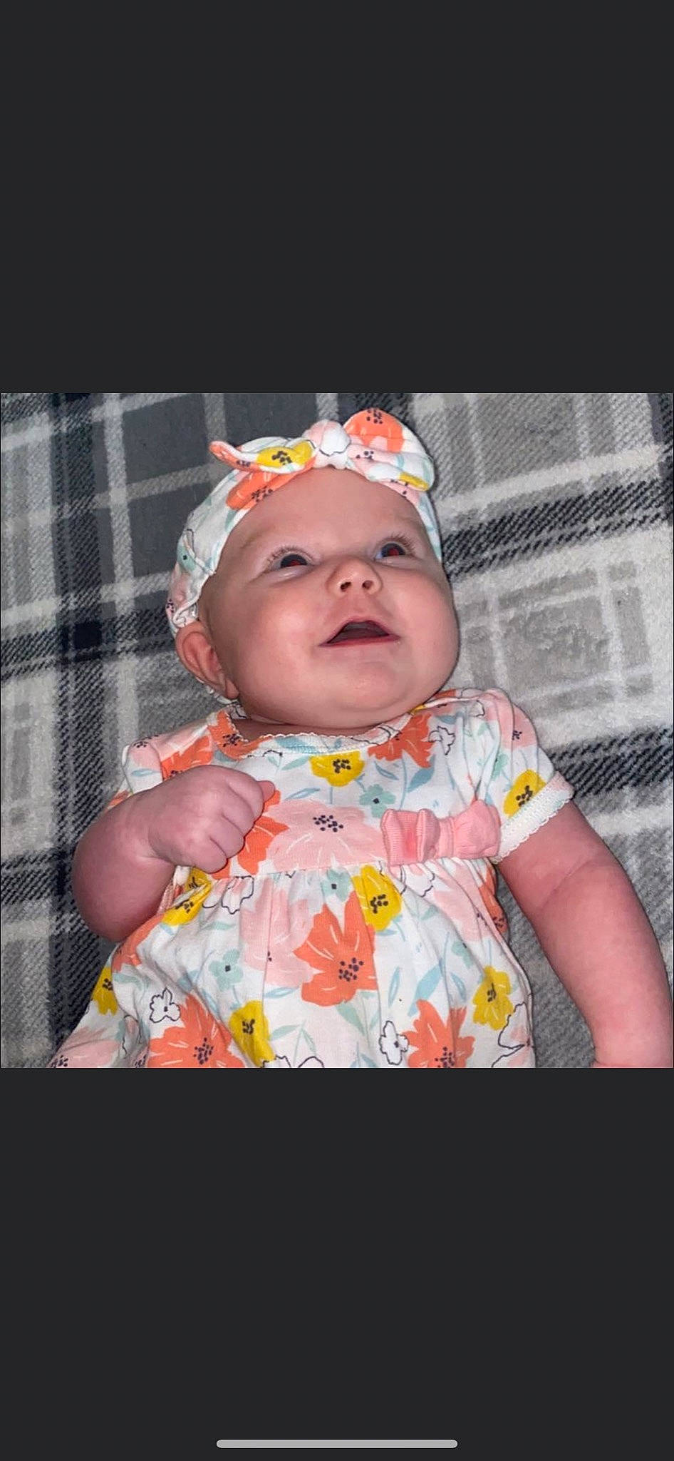 Camila is registered to the contest to win money with this photo: baby, baby_toddler_clothing, cap, cheek, child, dress, fashion_accessory, flash_photography, fun, goggles, grass, happy, headwear, lip, pattern, person, pink, plaid, sleeve, smile