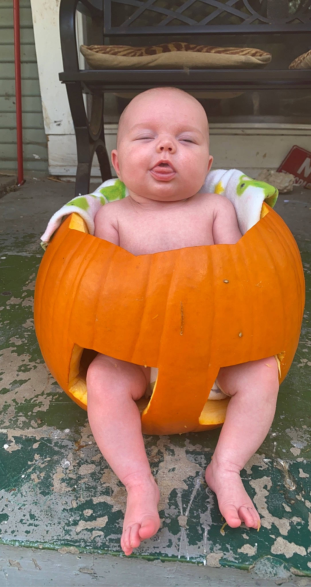 Camila joined the competition — help win amazing prizes! baby, baby_toddler_clothing, calabaza, dress, face, fun, grass, hand, head, headgear, mouth, orange, person, plant, pumpkin, skin, summer, thigh, toddler, winter_squash