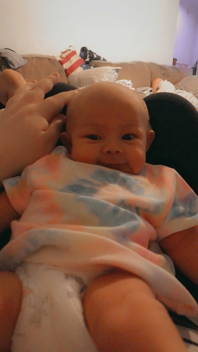 Azaylee is registered to the contest to win money with this photo: abdomen, baby, cheek, chest, child, comfort, event, finger, gesture, happy, linens, mouth, muscle, nail, person, room, skin, smile, thumb, toddler