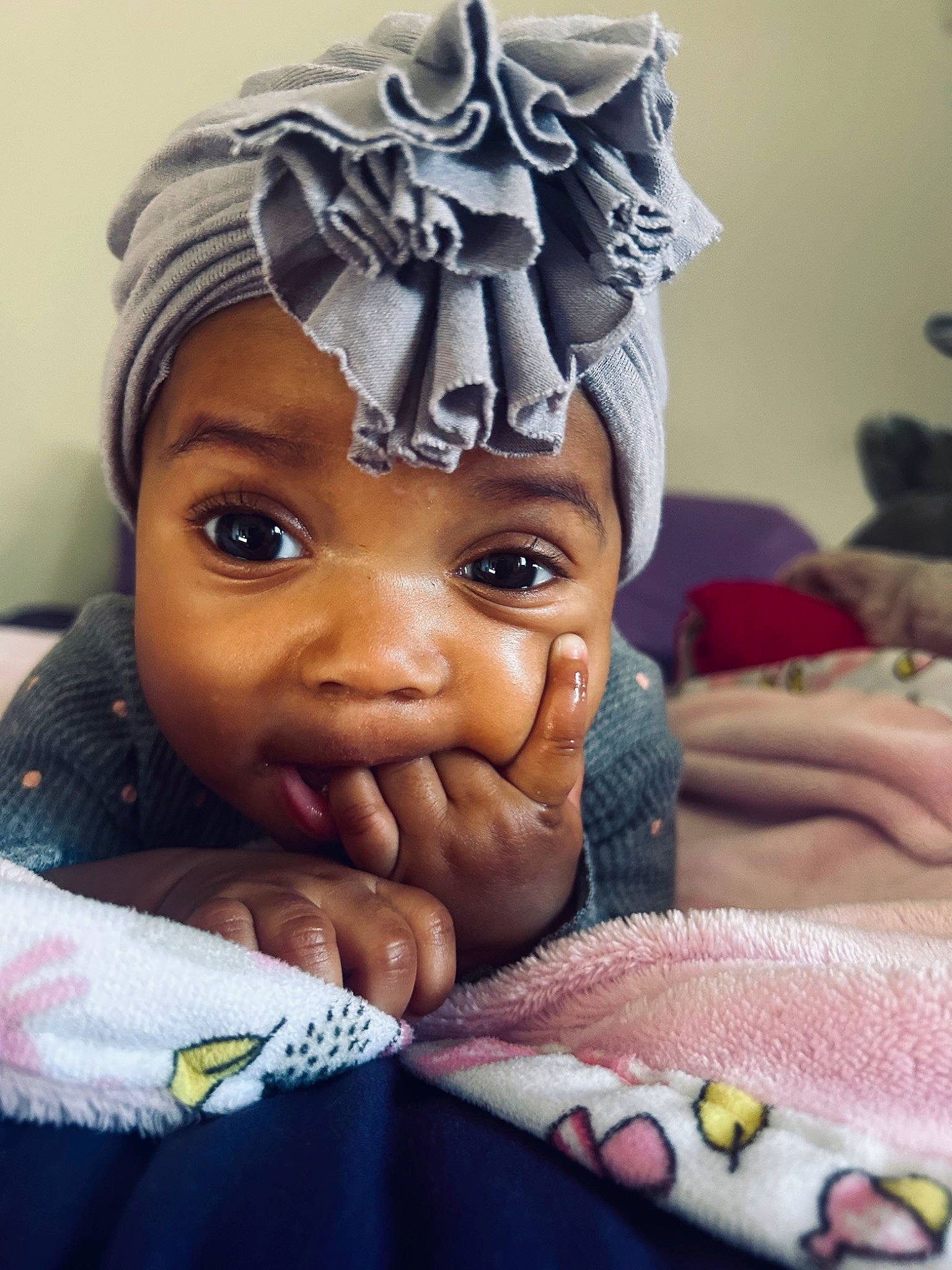 Malani is registered to the contest to win money with this photo: art, baby, cheek, eyebrow, eyelash, fashion_accessory, forehead, fun, gesture, happy, headgear, headpiece, mouth, nail, nose, person, skin, textile, thumb, toddler