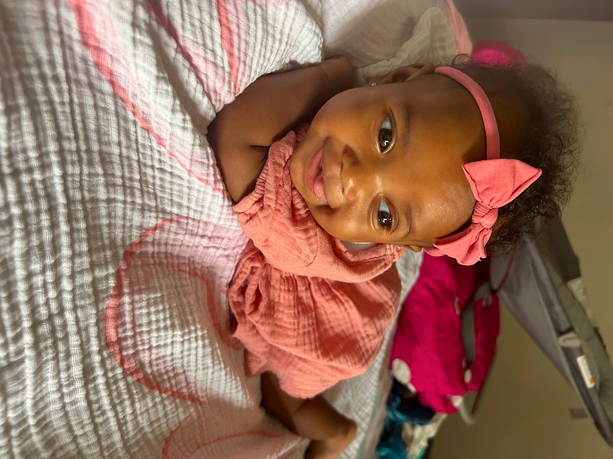 Malani is registered to the contest to win money with this photo: baby, baby_toddler_clothing, cheek, child, comfort, eyebrow, fashion_accessory, fun, happy, hat, lip, mouth, nose, person, plaid, skin, sleeve, smile, tartan, textile