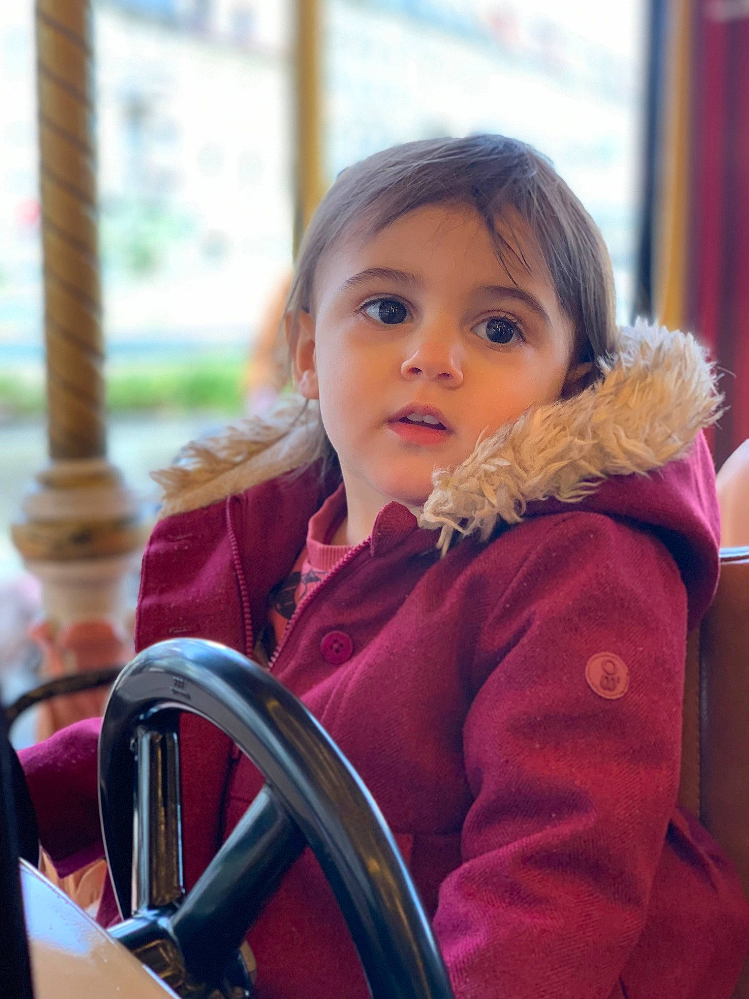 Maloé a rejoint le concours — aidez-le/la à gagner de superbes lots ! auto_part, automotive_wheel_system, beauty, chair, child, curtain, fun, fur, happy, jacket, leisure, motor_vehicle, person, portrait_photography, recreation, sitting, steering_wheel, toddler, tourism, travel