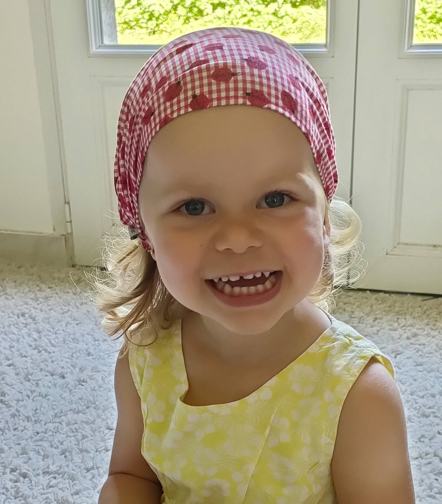 Rose participe au concours pour gagner de l'argent avec cette photo : baby_toddler_clothing, cap, child, door, eye, eyebrow, happy, head, headgear, headpiece, headwear, joy, lip, magenta, neck, outerwear, person, pink, selfie, smile