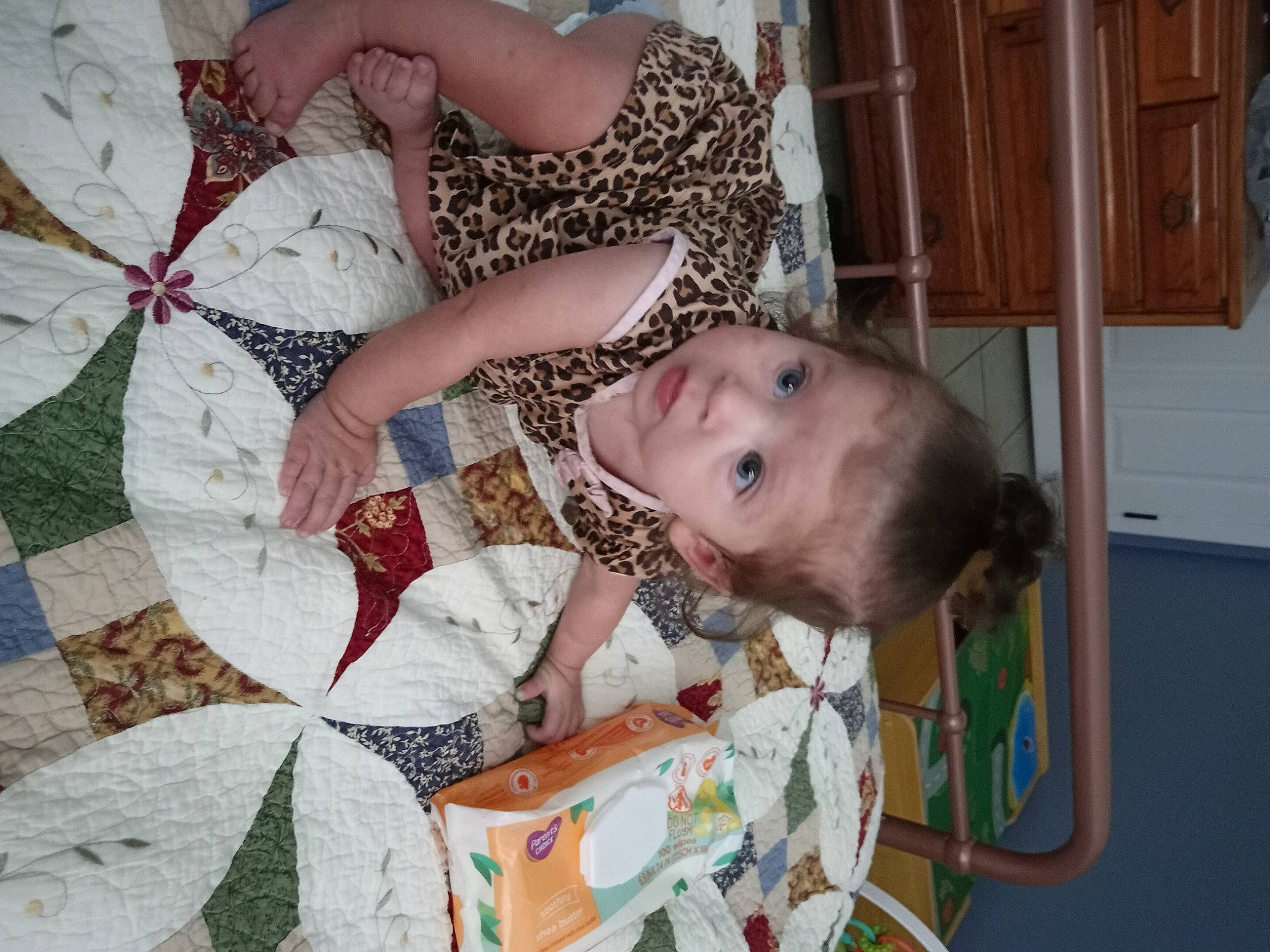 Cora is registered to the contest to win money with this photo: art, baby, baby_products, bedding, cabinetry, child, comfort, craft, fun, happy, linens, pattern, person, quilt, room, smile, textile, toddler, tree, visual_arts