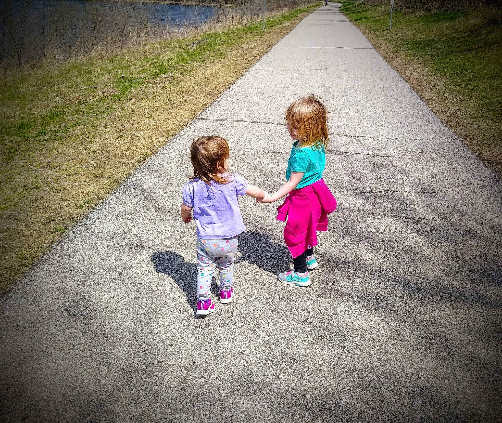 Felicity is registered to the contest to win money with this photo: asphalt, fun, gesture, grass, happy, lawn, leaf, leisure, magenta, mammal, people_in_nature, person, plant, recreation, road, road_surface, standing, sunlight, tints_and_shades, toddler