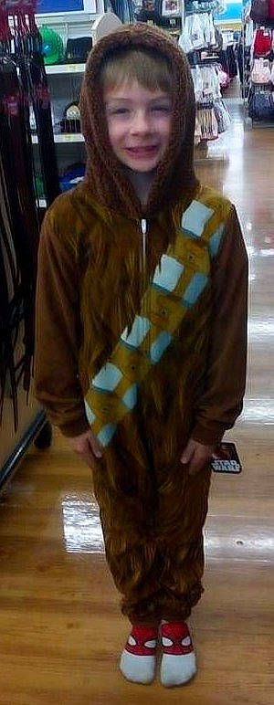 Seth is registered to the contest to win money with this photo: beard, blazer, electric_blue, eyewear, fashion_accessory, fashion_design, flooring, formal_wear, fun, fur, fur_clothing, hardwood, joy, pattern, person, shawl, sleeve, stole, street_fashion, trunk