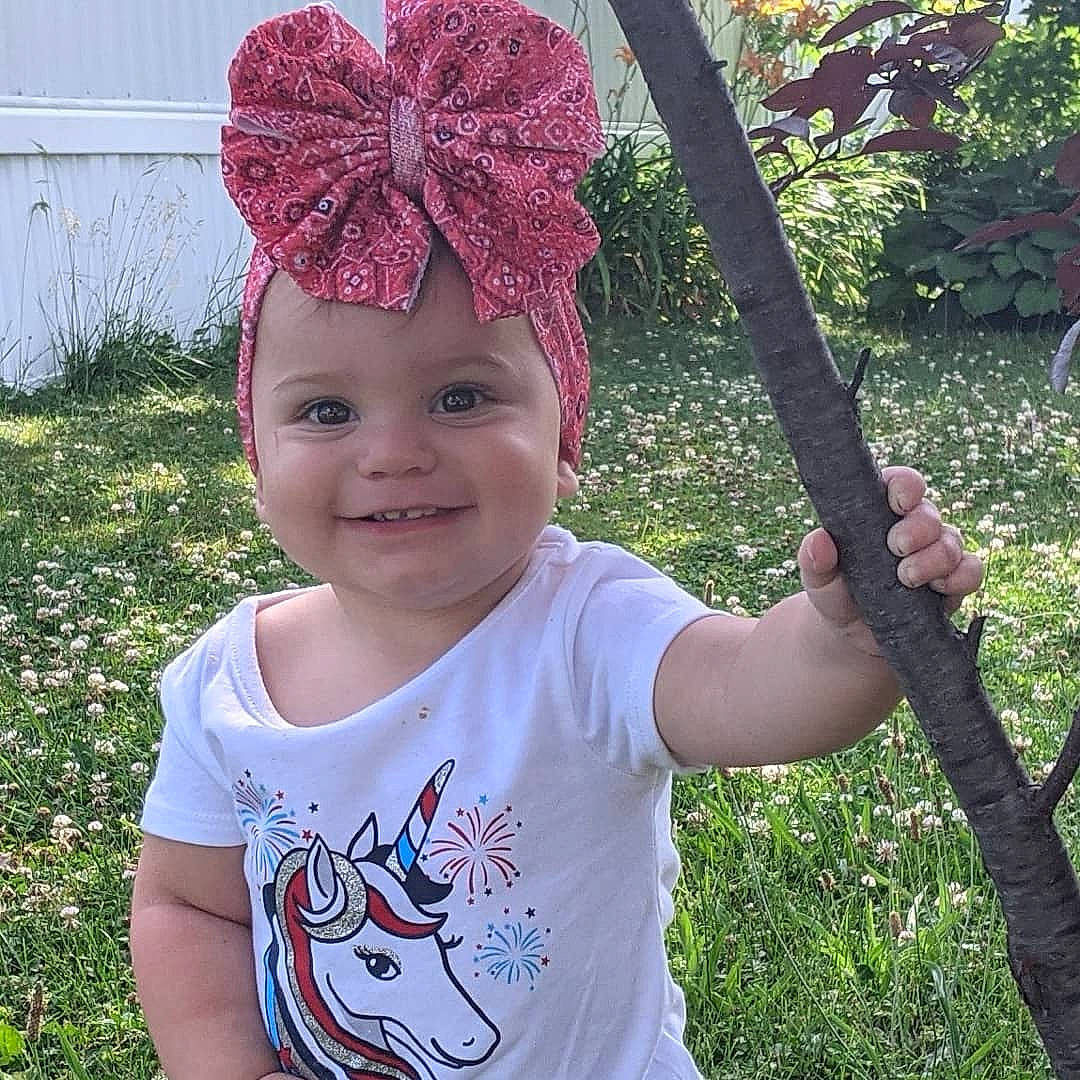 Mazikeen joined the competition — help win amazing prizes! baby_toddler_clothing, cap, cool, eye, face, gesture, grass, green, happy, head, headgear, headwear, joy, leaf, light, person, photograph, pink, plant, sleeve