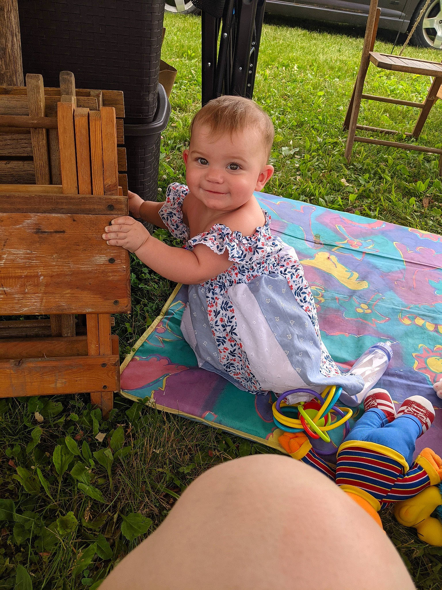 Mazikeen joined the competition — help win amazing prizes! baby_toddler_clothing, botany, chair, child, face, fun, grass, happy, joy, lap, leg, leisure, mammal, outdoor_furniture, person, public_space, shorts, smile, summer, thigh