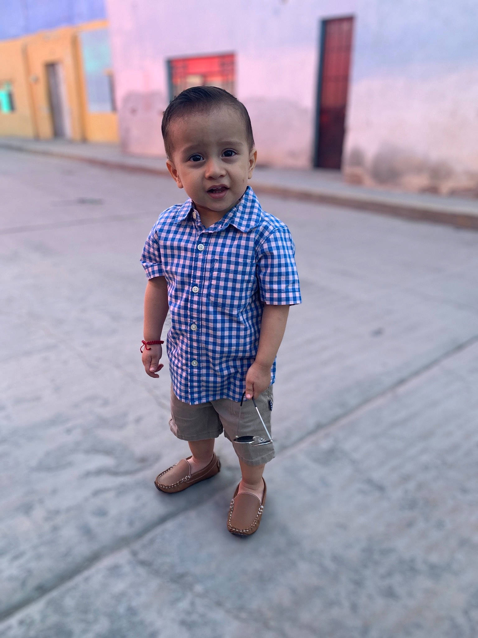 Elian is registered to the contest to win money with this photo: baby, baby_toddler_clothing, child, concrete, electric_blue, flooring, fun, happy, head, pattern, person, sandal, sitting, skin, sleeve, smile, standing, street_fashion, t_shirt, toddler