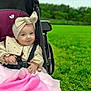 baby, child, stroller, headband, bow, blanket, outdoor, greenery, grass, smile, cute, infant, clothing, seatbelt, park, nature, portrait, happy, person, babyclothes