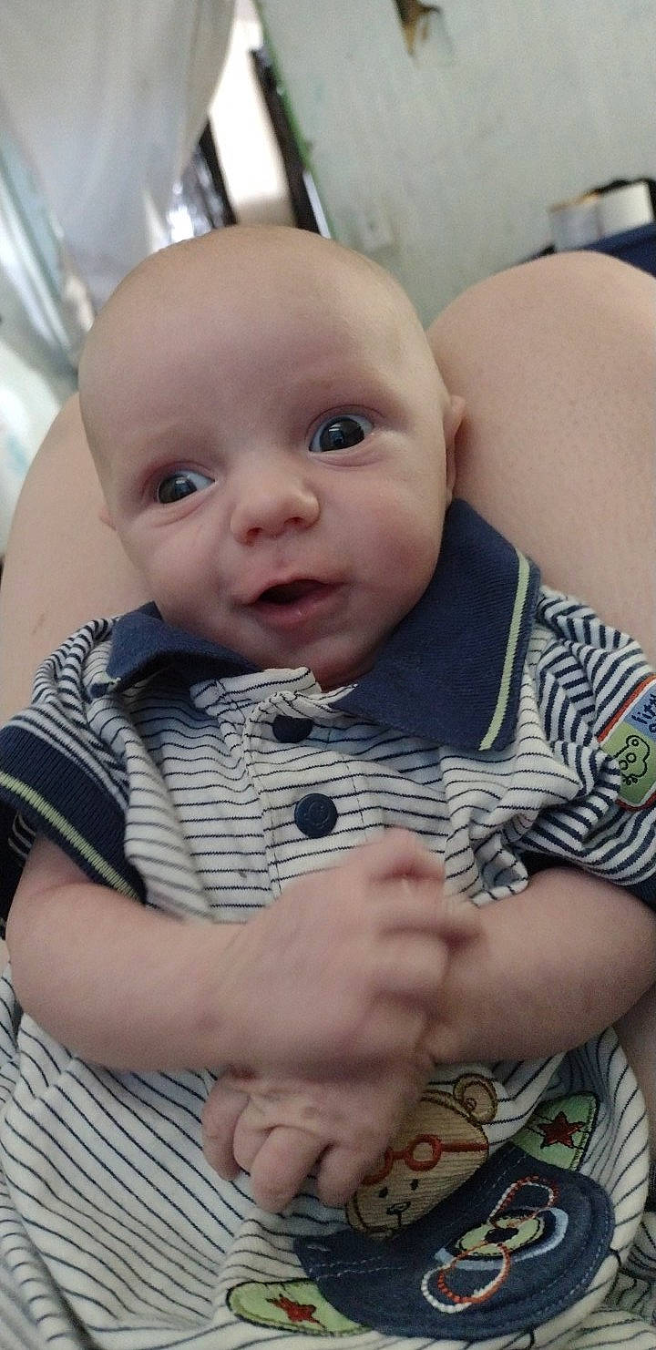 Declen is registered to the contest to win money with this photo: baby, baby_toddler_clothing, cheek, child, chin, comfort, eyebrow, eyelash, facial_expression, finger, fun, happy, iris, lip, mouth, person, sitting, skin, sleeve, smile