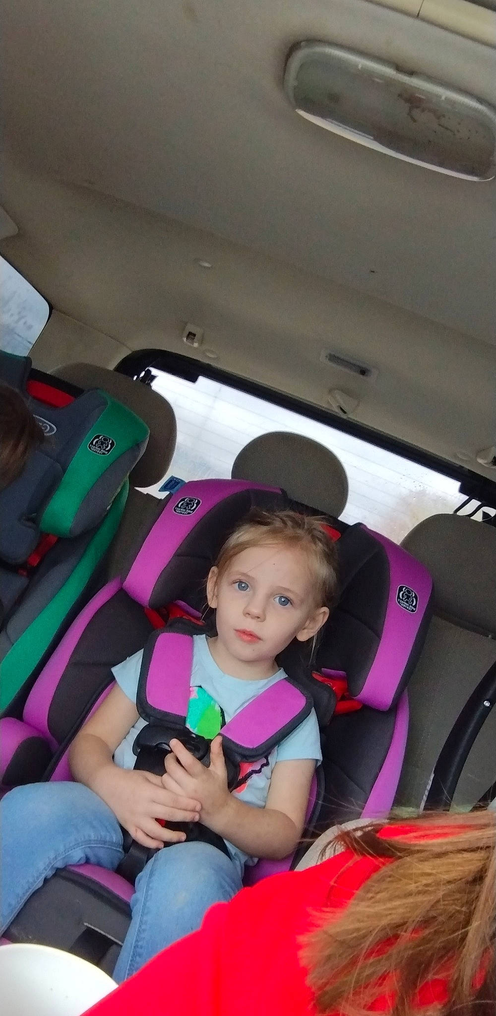 Nevaeh is registered to the contest to win money with this photo: auto_part, automotive_design, automotive_exterior, car, car_seat, car_seat_cover, child, comfort, fun, head_restraint, jeans, leisure, motor_vehicle, person, plant, seat_belt, steering_part, steering_wheel, toddler, vehicle