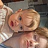 Ryker joined the competition — help win amazing prizes! adult, blond_hair, blue_eyes, casual_clothing, chair, child, close_up, face, family, furniture, glasses, home, indoor, photography, portrait, selfie, smile, surprised, toddler, wall