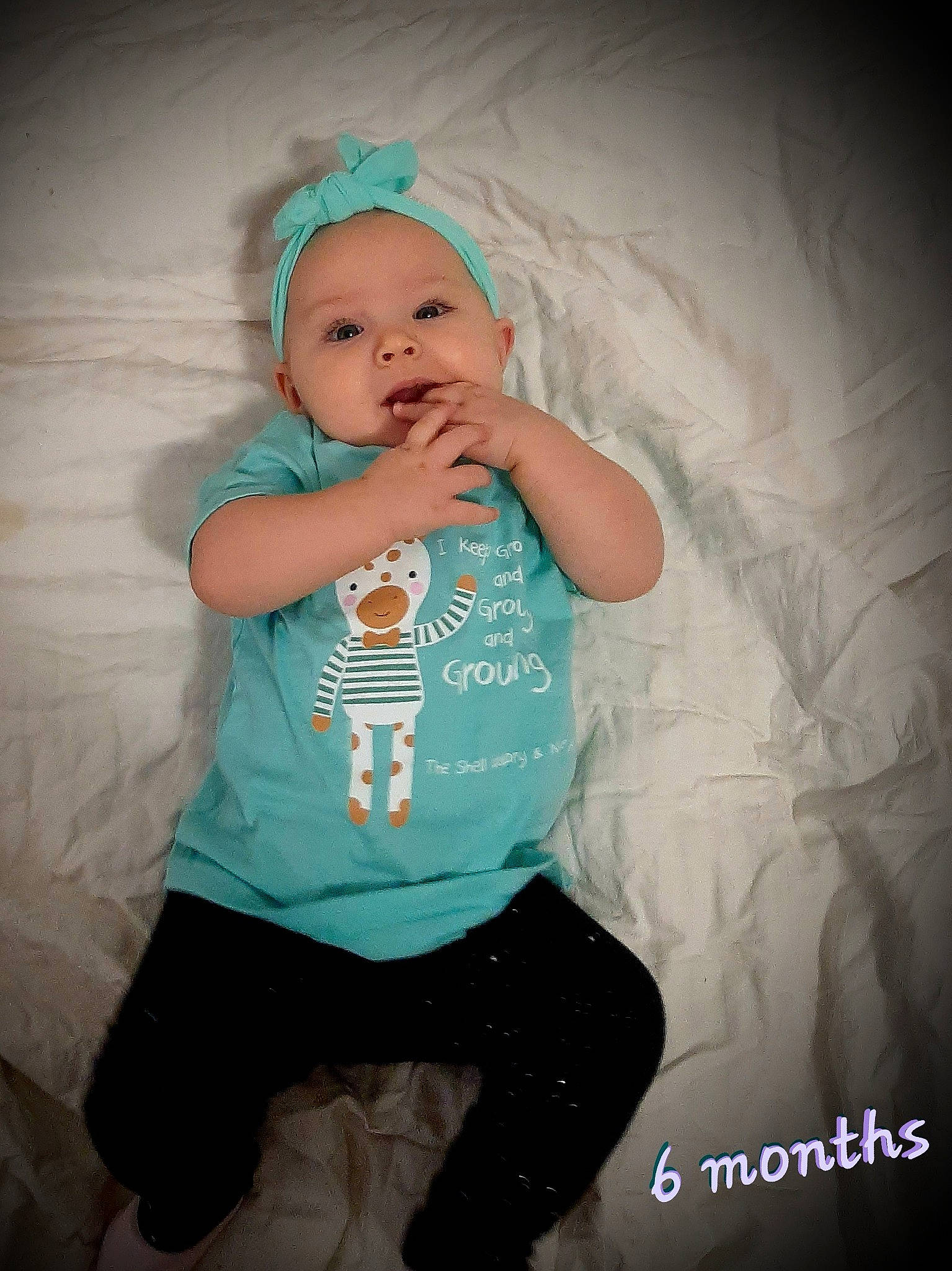 Arabella is registered to the contest to win money with this photo: baby, baby_toddler_clothing, cap, child, flash_photography, font, fun, happy, knee, magenta, pattern, person, personal_protective_equipment, portrait_photography, sitting, skin, sleeve, standing, t_shirt, thigh