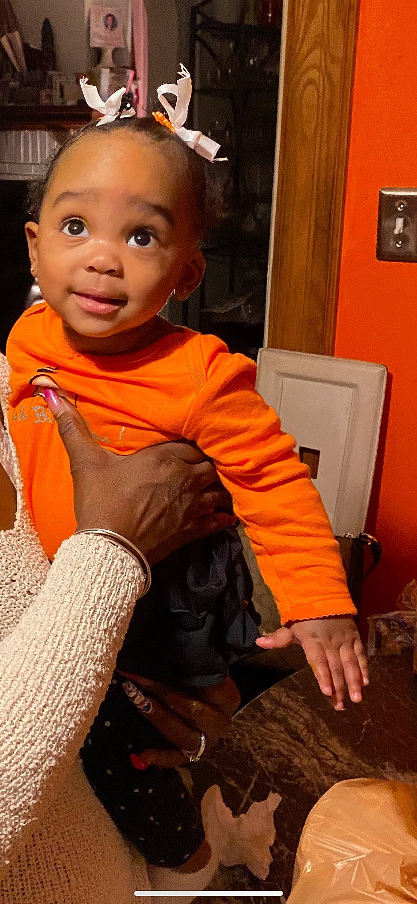 Karri joined the competition — help win amazing prizes! baby_toddler_clothing, child, chin, comfort, cool, finger, flooring, hairstyle, happy, head, human_leg, knee, leg, orange, person, picture_frame, sleeve, smile, t_shirt, thigh