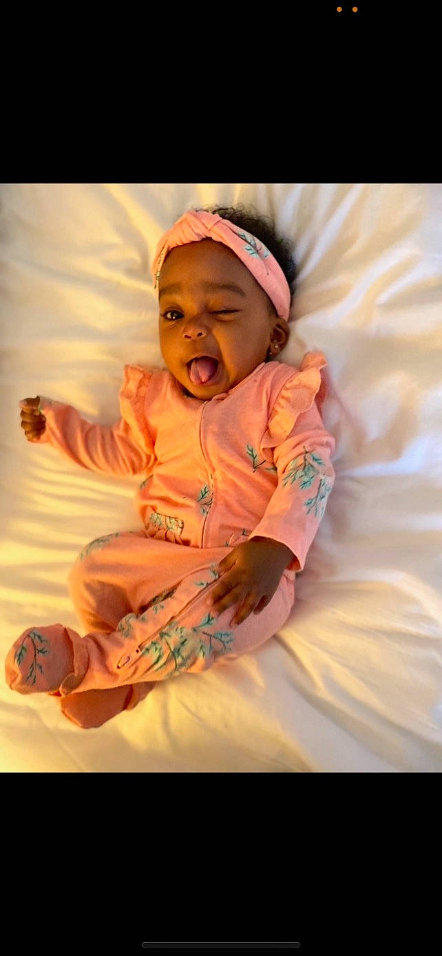 Karri joined the competition — help win amazing prizes! baby, baby_toddler_clothing, child, comfort, finger, flash_photography, fun, happy, headwear, lip, magenta, orange, peach, person, pink, sitting, sleeve, smile, t_shirt, textile