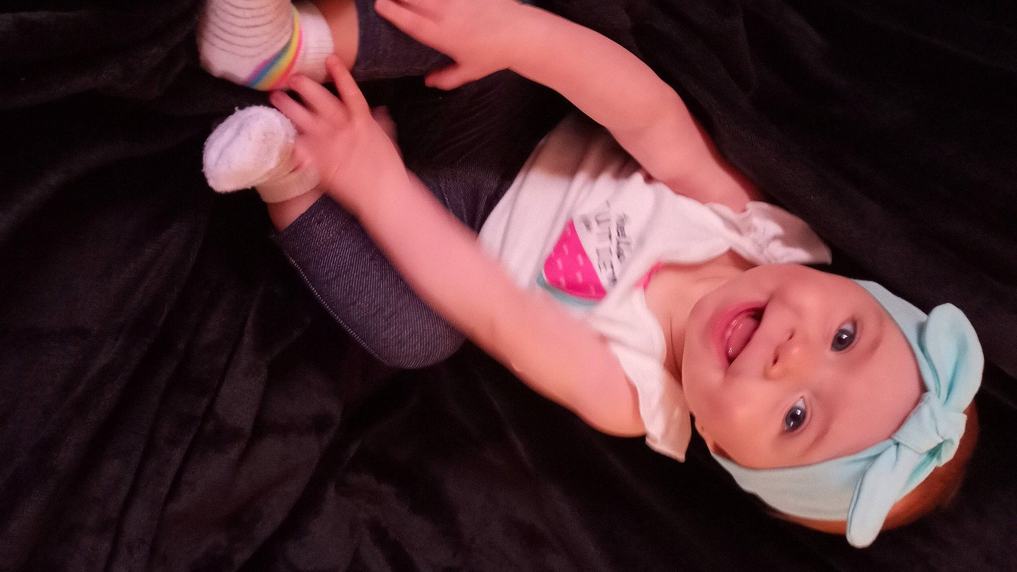 Jasmin is registered to the contest to win money with this photo: arm, baby, baby_toddler_clothing, elbow, finger, flash_photography, fun, gesture, hand, happy, hat, headwear, human_body, joy, leg, mouth, nail, person, pink, sleeve