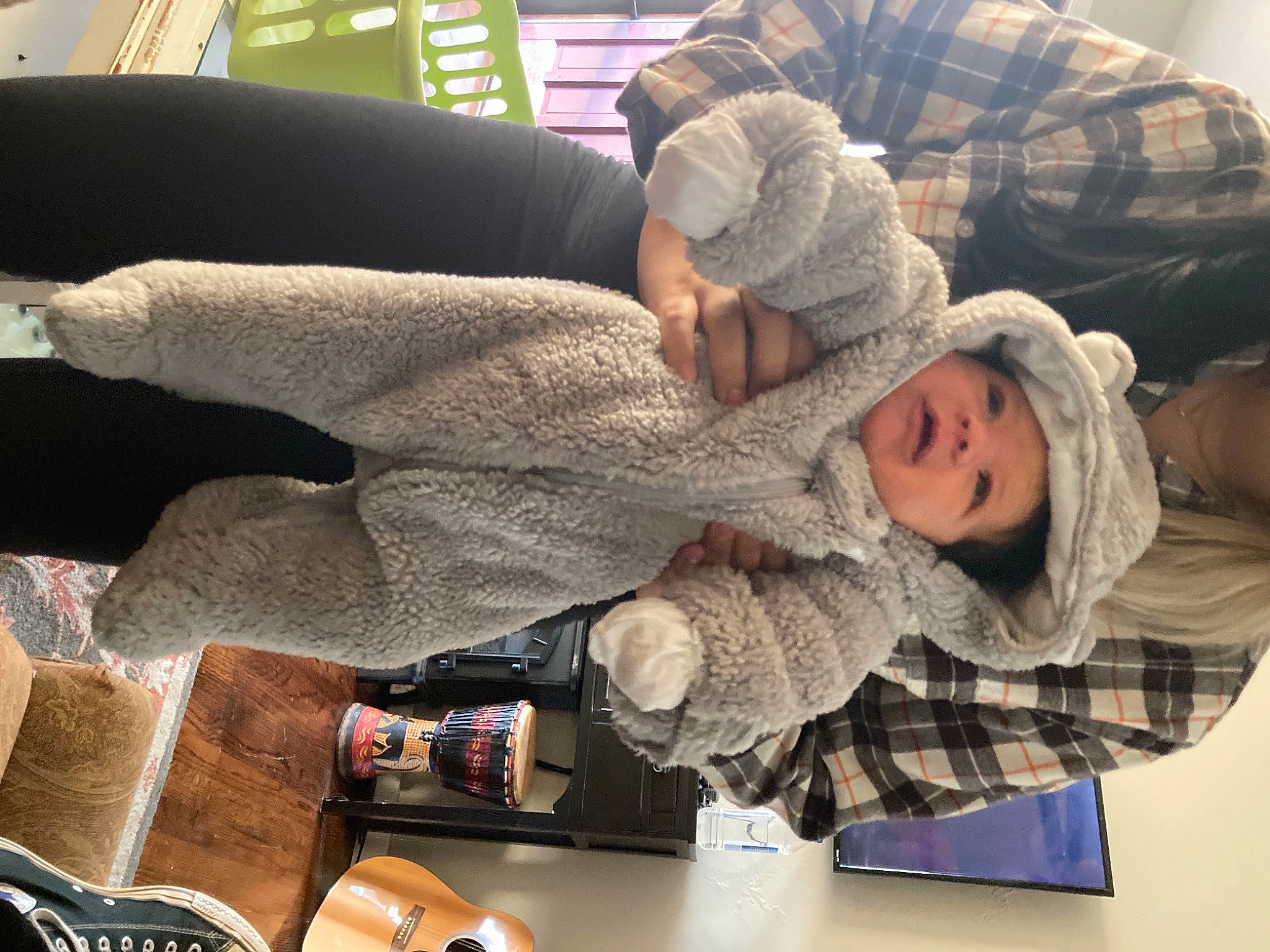 Jonah is registered to the contest to win money with this photo: baby, child, comfort, fun, fur, gesture, headwear, knit_cap, lap, nail, pattern, person, sitting, thumb, toddler, water_bottle, winter, wool, woolen