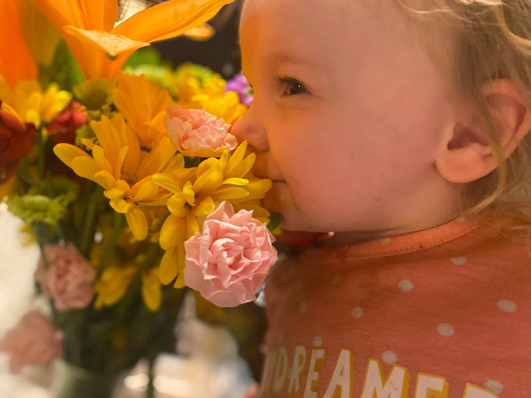 Emelia is registered to the contest to win money with this photo: baby, baby_toddler_clothing, bouquet, child, close_up, cut_flowers, dress, eyelash, flower, flower_arranging, flowering_plant, happy, iris, orange, person, petal, pink, plant, rose, rose_family