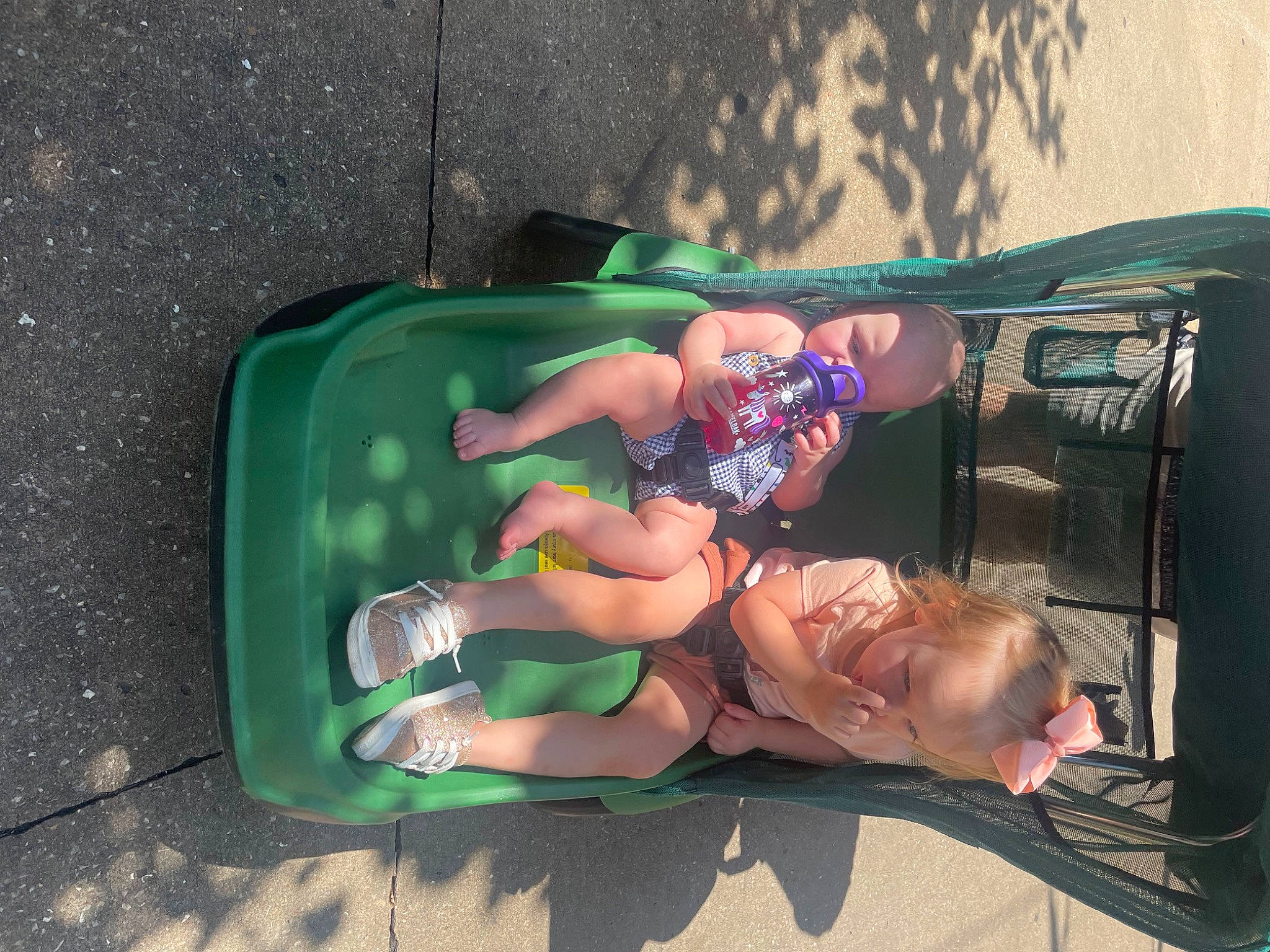 Evan is registered to the contest to win money with this photo: asphalt, auto_part, automotive_exterior, boot, bumper, child, costume, event, fun, grass, human_leg, leisure, motor_vehicle, person, personal_protective_equipment, recreation, sidewalk, sneakers, sock, thigh