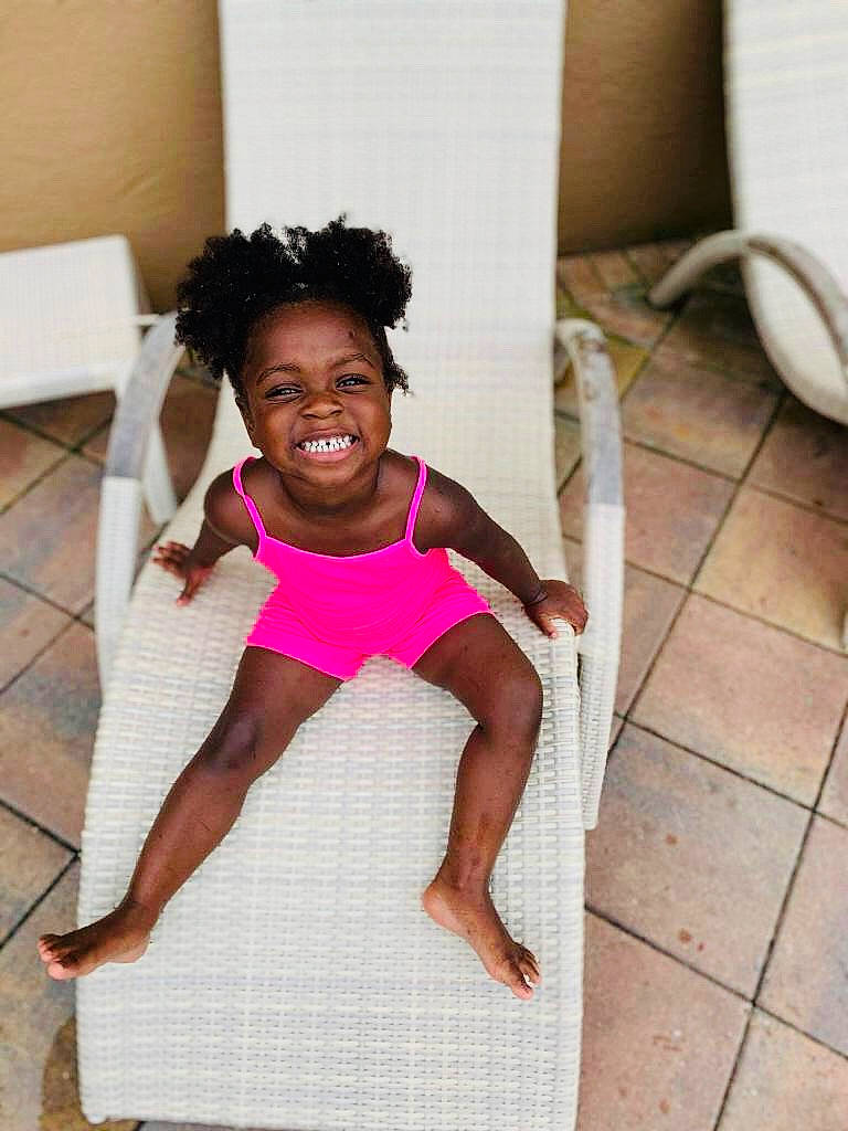 Cherish is registered to the contest to win money with this photo: child, floor, flooring, fun, happy, head, joy, leg, person, pink, play, shoulder, smile, toddler, vacation