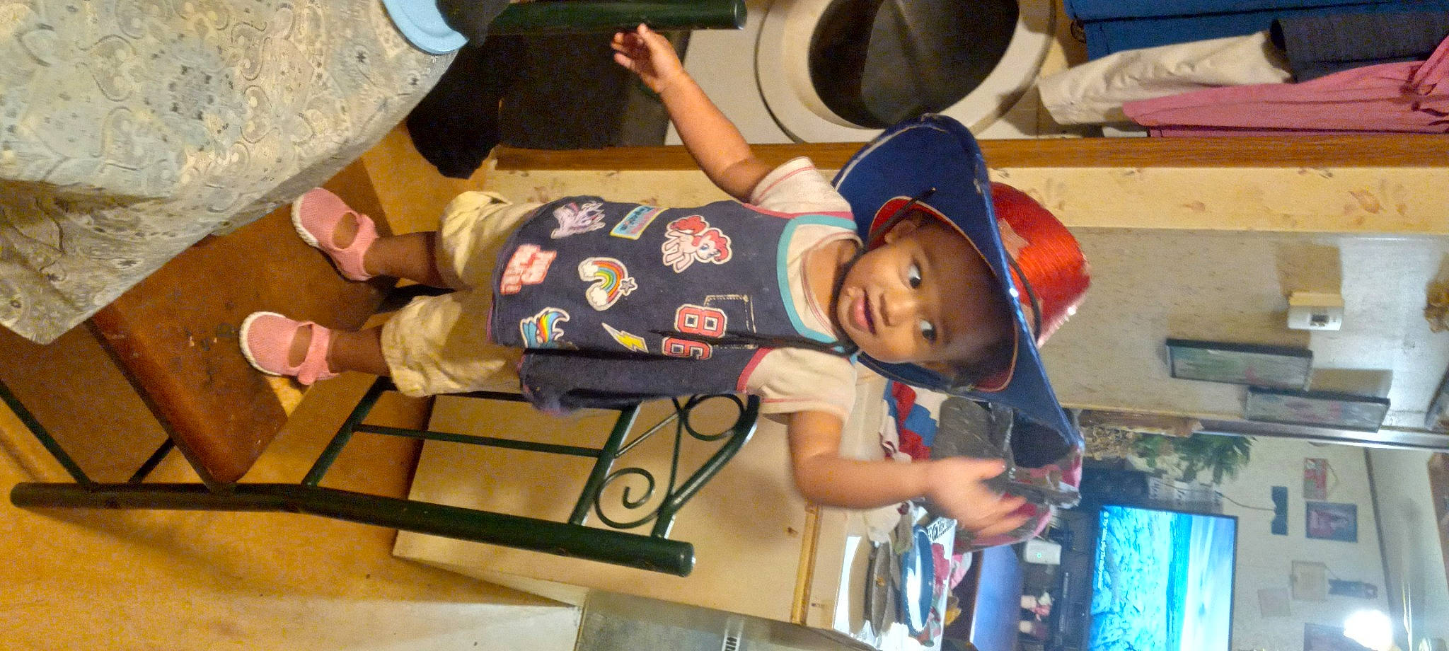 Heather joined the competition — help win amazing prizes! arm, audio_equipment, baby, baby_toddler_clothing, baseball_cap, cap, child, elbow, electric_blue, fun, hat, headwear, leisure, person, play, recreation, room, shoe, smile, t_shirt