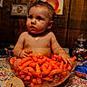 baby, child, cheese_puffs, snack, bowl, tablecloth, milestone_sign, ten_months, messy, curious, orange, food, indoor, portrait, cheesy_fingers, face, hair, celebration, sitting, hands