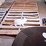 Madea is registered to the contest to win money with this photo: cat, white_cat, animal, pet, warehouse, pallets, wood, industrial, outdoor, walking, standing, warehouse_floor, corrugated_metal, workplace, social_media, text_overlay, quote, portrait_orientation, funny, feline
