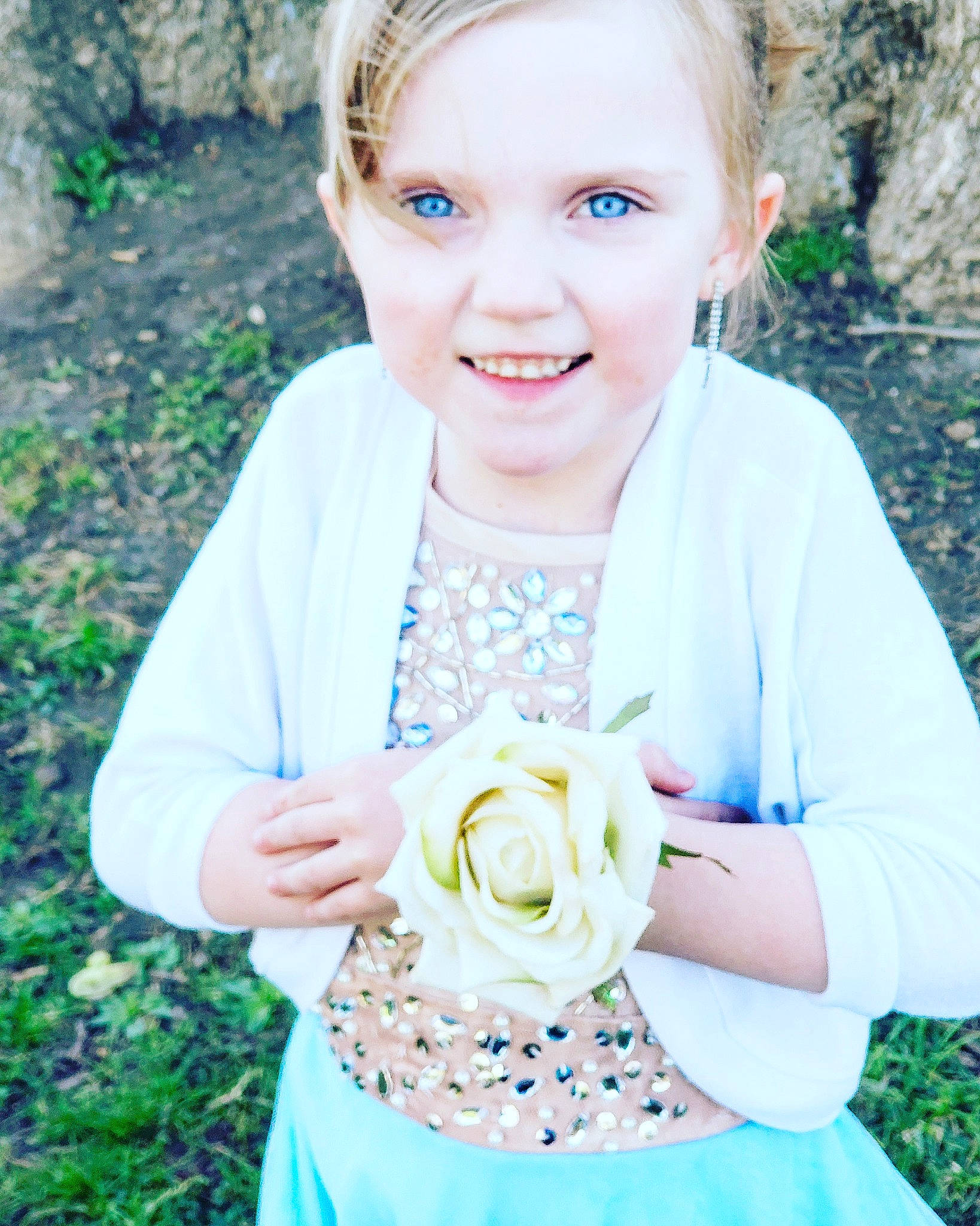 Annabell is registered to the contest to win money with this photo: bouquet, bride, child, dress, fashion_accessory, flower, hair_accessory, happy, joy, person, photo_shoot, photograph, photography, plant, portrait, portrait_photography, smile, wildflower, yellow