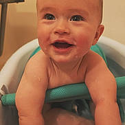 Owen joined the competition — help win amazing prizes! baby, child, bath, tub, water, smiling, happy, indoor, skin, face, arms, legs, droplets, closeup, cute, infant, joyful, expression, sitting, playful