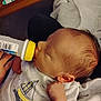 Kash joined the competition — help win amazing prizes! baby, feeding, bottle, infant, clothing, hand, face, sleeping, newborn, cute, blanket, indoors, person, young_child, sleeve, resting, peaceful, hair, soft, comfort