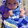 baby, infant, child, portrait, blue_clothing, bonnet, ruffles, dress, sitting, carpet, indoor, face, eyes, hands, serious_expression, centered_composition, close_up, colorful, soft_fabric, family_photo