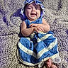 Piper is registered to the contest to win money with this photo: baby, child, infant, smiling, happy, portrait, indoor, carpet, floor, dress, blue_clothing, sunhat, ruffles, sitting, lying_down, hands, feet, toes, cozy, home
