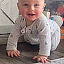 Varek joined the competition — help win amazing prizes! baby, crawling, smiling, onesie, floor, wooden_floor, toys, stuffed_animals, indoor, child, happy, cute, face, hands, carpet, home, play, infant, person, young_child