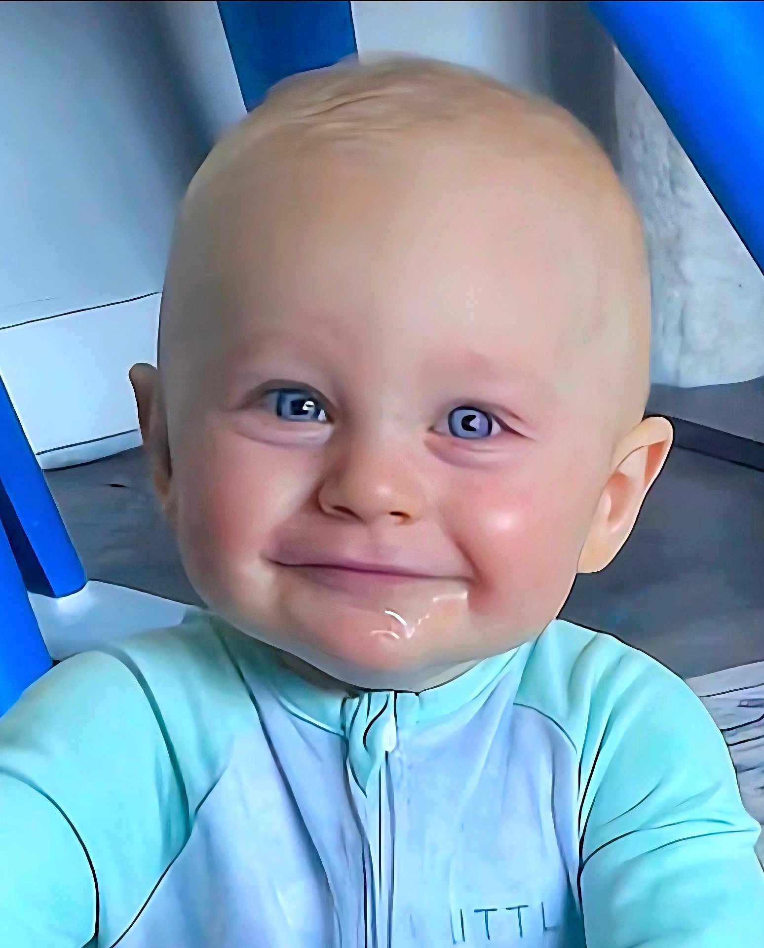 Varek is registered to the contest to win money with this photo: baby, child, blue_eyes, drool, smile, face, indoor, furniture, blue_clothing, head, young_child, cute, expression, sitting, cheeks, person, portrait, skin, happiness, infant