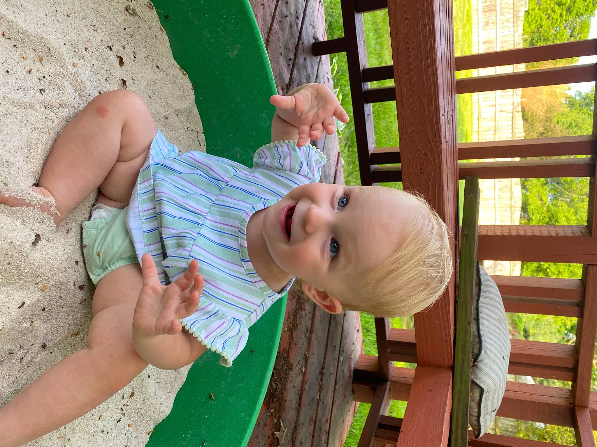Alexandra is registered to the contest to win money with this photo: baby, baby_toddler_clothing, child, finger, fun, grass, happy, joy, leisure, outdoor_play_equipment, people_in_nature, person, plant, public_space, recreation, skin, smile, summer, swing, toddler