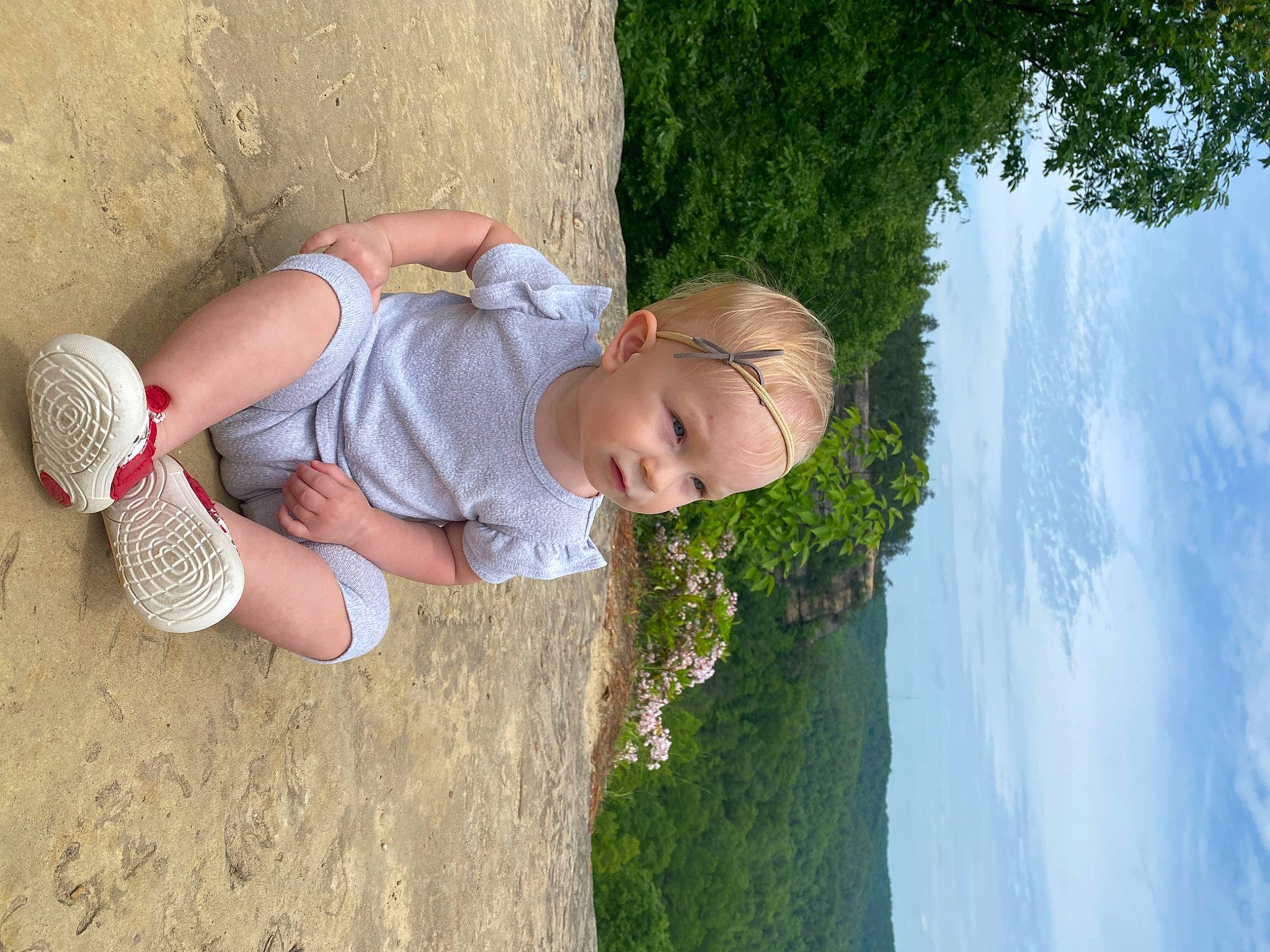 Alexandra joined the competition — help win amazing prizes! baby, baby_toddler_clothing, child, cloud, eye, fun, grass, happy, headwear, leaf, leisure, nature, people_in_nature, person, plant, sitting, sky, toddler, tree, vacation