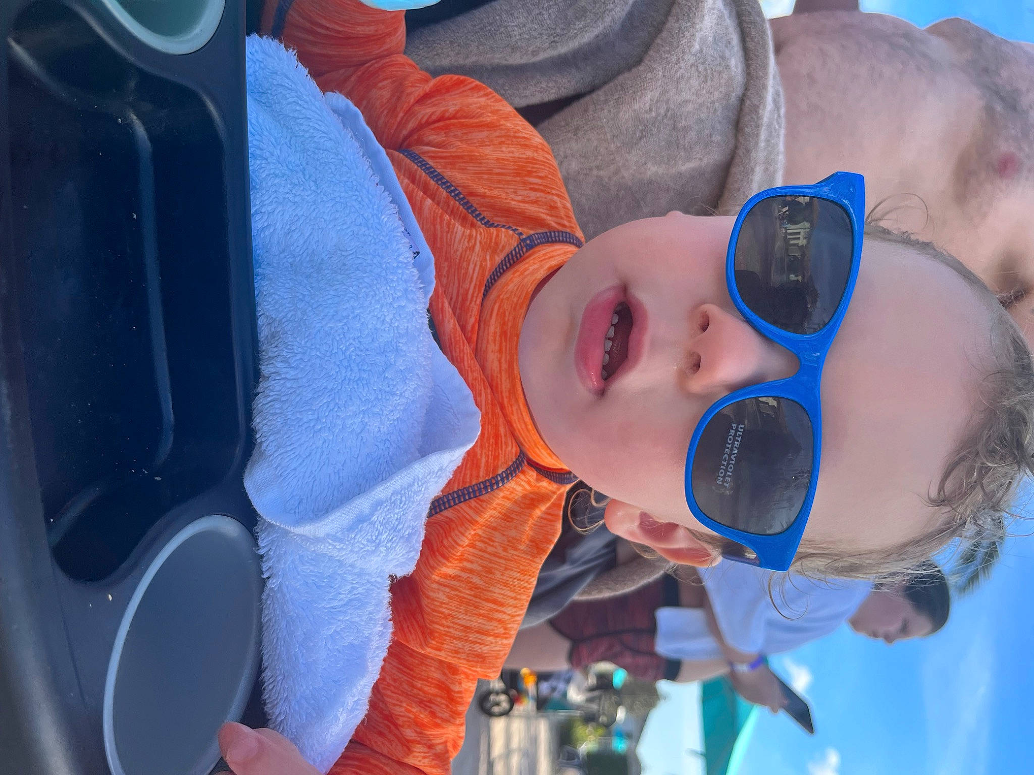 Justin is registered to the contest to win money with this photo: azure, blue, electric_blue, eyewear, fun, gesture, goggles, happy, headgear, leisure, light, nose, person, personal_protective_equipment, recreation, sky, sunglasses, toddler, vehicle_door, vision_care