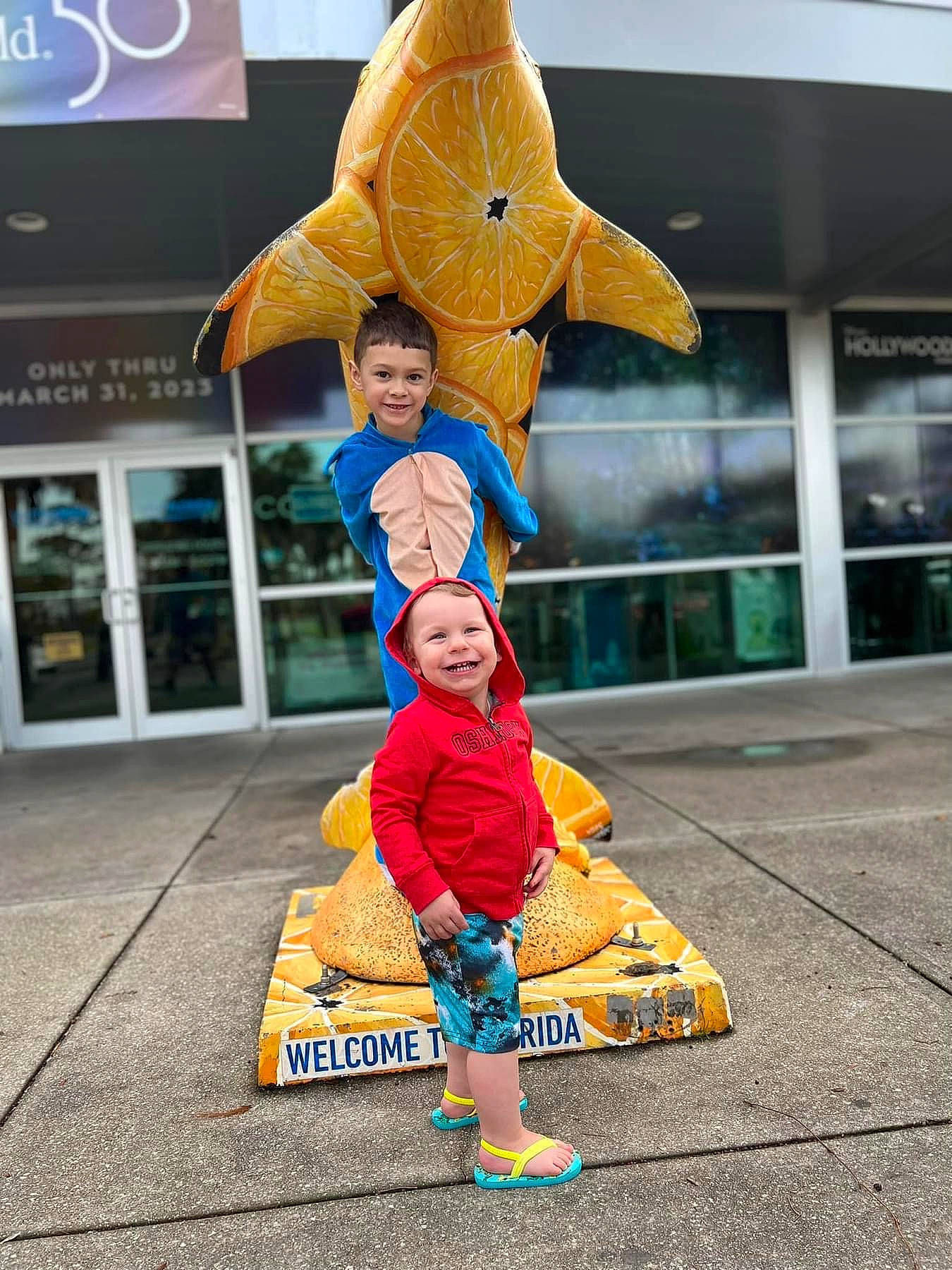 Justin is registered to the contest to win money with this photo: child, child_art, costume, event, fictional_character, fun, happy, hat, headwear, joy, leisure, mascot, orange, person, photograph, recreation, sandal, smile, snapshot, toddler