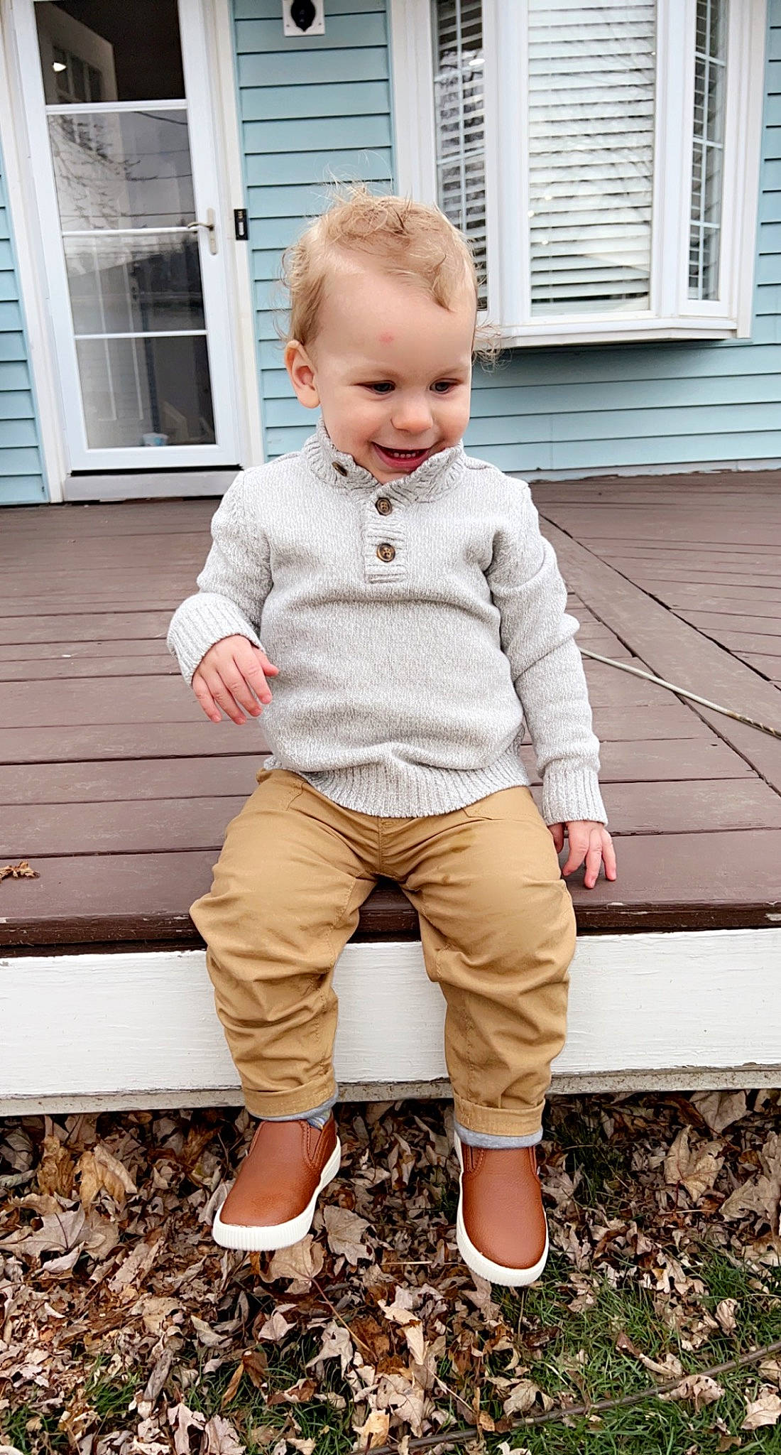Justin is registered to the contest to win money with this photo: baby, baby_toddler_clothing, child, denim, eye, face, grass, grey, hairstyle, happy, joy, leg, person, plant, sleeve, smile, standing, t_shirt, toddler, white
