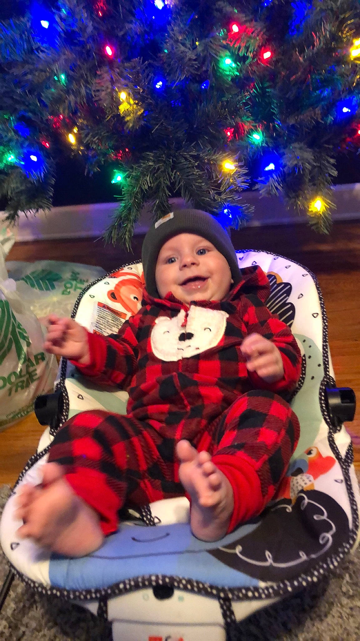 Justin Jr joined the competition — help win amazing prizes! baby, baby_toddler_clothing, blue, child, christmas, christmas_decoration, christmas_eve, christmas_ornament, christmas_tree, event, facial_expression, fun, happy, head, headwear, holiday, human_body, joy, person, plant